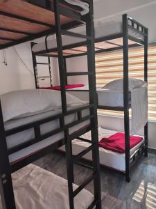a bunk bed room with two bunk beds at Poozhikuth Homestay in Sultan Bathery