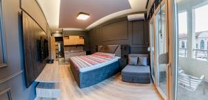 a small room with a bed and a chair at Villa Sveti Gorgi in Ohrid