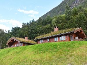 a house with a grass roof on top of a hill at 5 person holiday home in olden in Olden