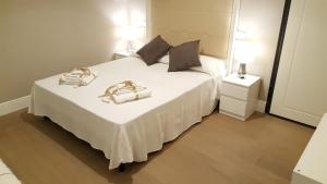 A bed or beds in a room at Scala Suite
