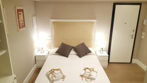 Кровать или кровати в номере Scala Suite