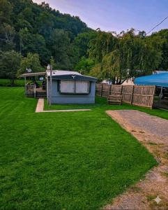 a gazebo and a bench in a yard at Mem's Place in Bluefield