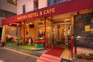 a restaurant with tables and chairs in front of it at Sakura Hotel Jimbocho in Tokyo