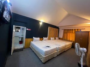 a bedroom with a large white bed in a room at Saanvi Hotel & Restaurant in Kathmandu
