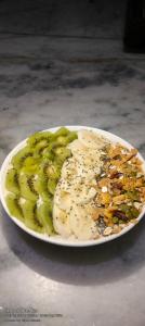 a plate of food with pickles on a table at Little Peepal House in Udaipur