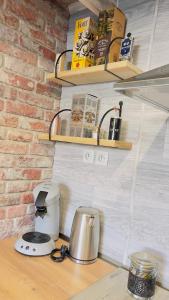 a kitchen counter with a coffee maker on a table at Top Loft Perles 4 des Châteaux in Mer