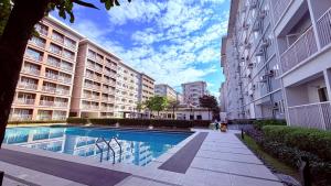 a swimming pool in the middle of a building at TIRPT Staycation in Manila