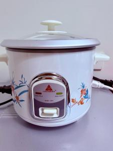 a white pot with a lid sitting on a table at TIRPT Staycation in Manila