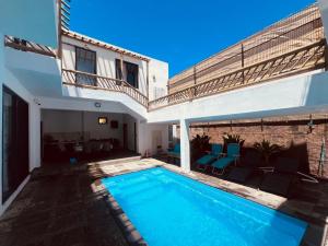 a swimming pool in the backyard of a house at Cloudview Villa in Mahébourg