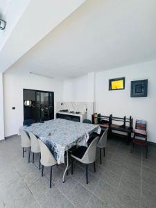 a dining room with a table and chairs at Cloudview Villa in Mahébourg