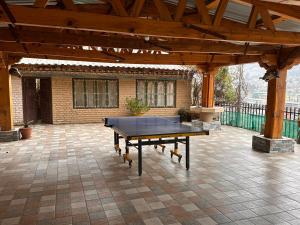 a ping pong table sitting on a patio at Jambayang Resort in Thimphu
