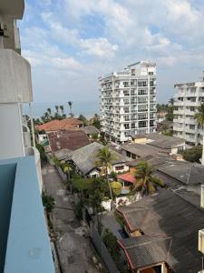 arial view of a city with buildings and palm trees at 2BR luxury Apartment in Mount Lavinia - Benetia Stay in Mount Lavinia