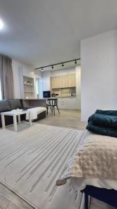 a bedroom with a bed and a living room at Vedo apartment 3 Тячів in Tyachiv