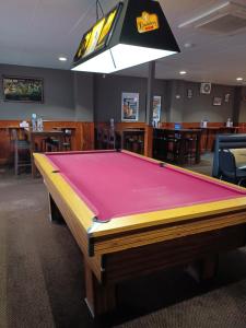 a ping pong table in a room with a pool at GRAND CENTRAL HOTEL PROSERPINE in Proserpine