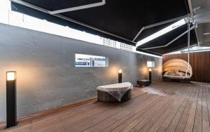 a room with a bedroom with a bed and lights at 호텔이데아 울산삼산점 in Ulsan