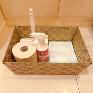 a basket with a toilet and a bottle of cleaner at NUDA Toyama in Takaoka +31 photos