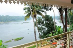 a view of the river from a balcony at SHANKARAM Homestay in Kodanad +5 photos