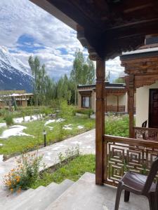 a porch of a house with a view of a mountain at Royal Soma Resort in Stak