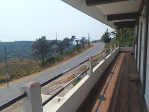 a view of a road from a building next to a road at Joyous Rooms in Cherrapunji
