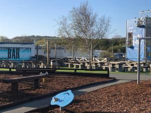 a park with a skateboard ramp in the dirt at Dunes Views in Prestatyn