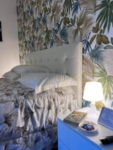 a bedroom with a bed and a desk with a lamp at Osteria del Cavaliere B&B e Maneggio in Sacrofano +111 photos