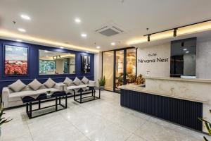 a lobby with couches and a counter in a store at Nirvana Nest - Corporate Stay, Gomti Nagar, Lucknow in Lucknow