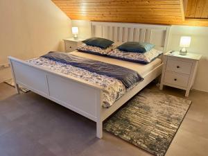 a bedroom with two beds and two night stands at Dům pod horami - Beskydy in Frýdlant nad Ostravicí