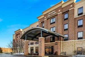 a brick building with an archway in front of it at Hampton Inn & Suites Detroit-Canton in Canton