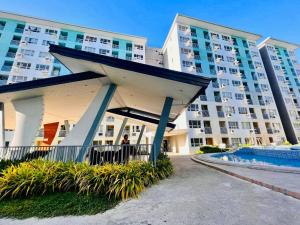 a large apartment building with a large building at Seawind in Davao City