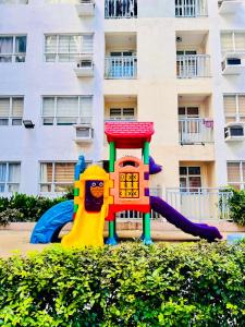 a playground in front of a building at Seawind in Davao City