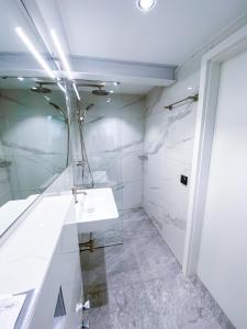 a bathroom with a sink and a mirror at Kreilingshöfchen Apartments in Bad Vilbel +3 photos