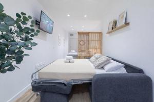 a hospital room with two beds and a tv at Valencia Marina Apartment near Beach & City of Arts in Valencia