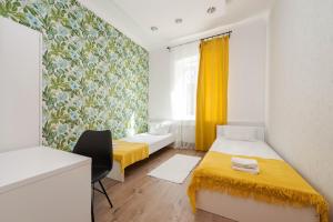 a small room with two beds and a window at ROYAL ROOMS*** in Ljubljana