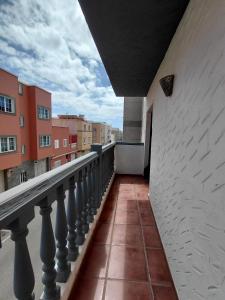 a view of a balcony of a building at Sun Home Arinaga in Arinaga