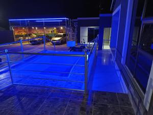 a view of a building at night with blue lights at Baraba's guest house in Nelspruit +7 photos