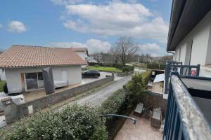 a view from a balcony of a house with a car at Villas del Empereur in Hendaye