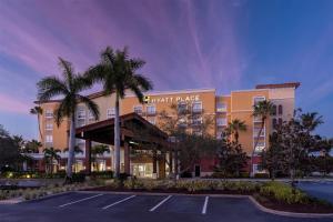 a hotel with a parking lot in front of it at Hyatt Place Fort Myers Estero - Newly Renovated in Estero