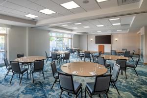 a conference room with tables and chairs and a podium at Hyatt Place Fort Myers Estero - Newly Renovated in Estero +51 photos