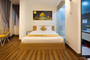 a bedroom with a bed in a room at ROMANCE HOTEL DALAT in Da Lat +37 photos