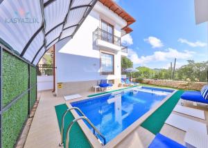 an image of a villa with a swimming pool at Villa Mars in Kaş +7 photos
