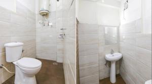 a white bathroom with a toilet and a sink at Hotel Vijay Palace Dharamshala Himachal in Dharmsāla