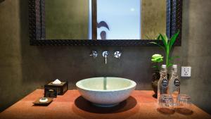 a bowl sink on a counter in a bathroom at Golden Temple Villa in Siem Reap +125 photos