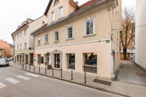 a building on the side of a street at ROYAL ROOMS*** in Ljubljana