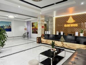 a lobby of a hotel with a reception desk at Glory House in An Khê