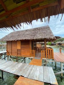 a house on a dock in the water at Angelfish Guest House Raja Ampat in Besir