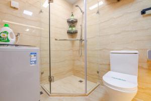 a shower stall in a bathroom with a toilet at 上海晶彩酒店式公寓江桥万达店 in Shanghai +63 photos