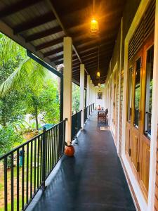 a hallway of a house with a porch at Sigiriya Dream Inn in Sigiriya