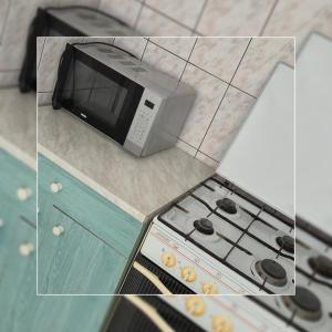 O bucătărie sau chicinetă la Master apartman