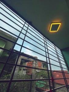 a window in a building with a view of a building at Êm Tiny in Hai Phong