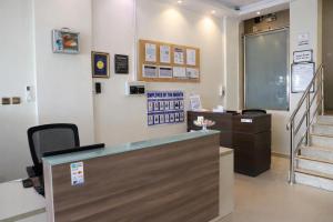 a lobby with a cash counter and a staircase at Binayat Hama Serviced Apartments - Standard in Al Jubail